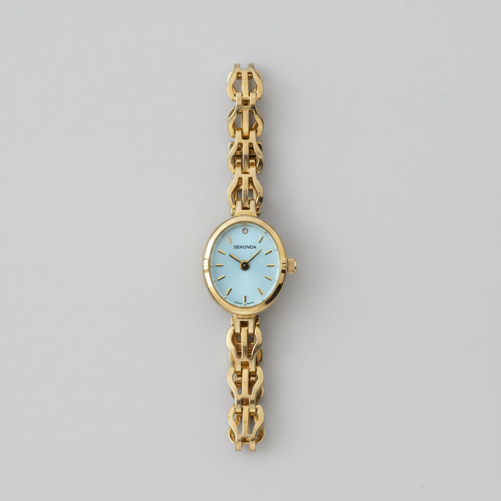 Vintage Ladies Sekonda gold tone watch with Oval Mother of Pearl face and intricate linked Bracelet
