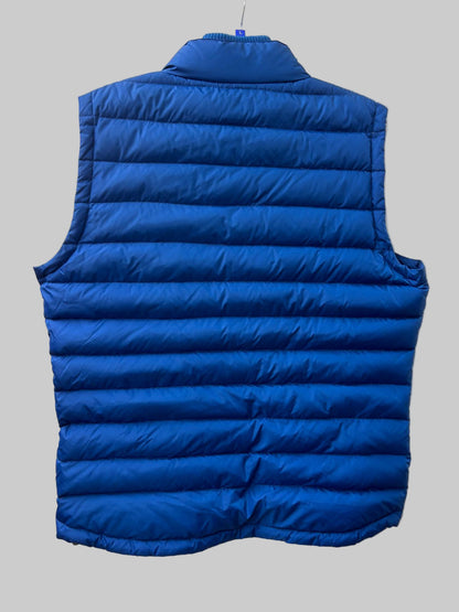 Blue puffer vest on a white background