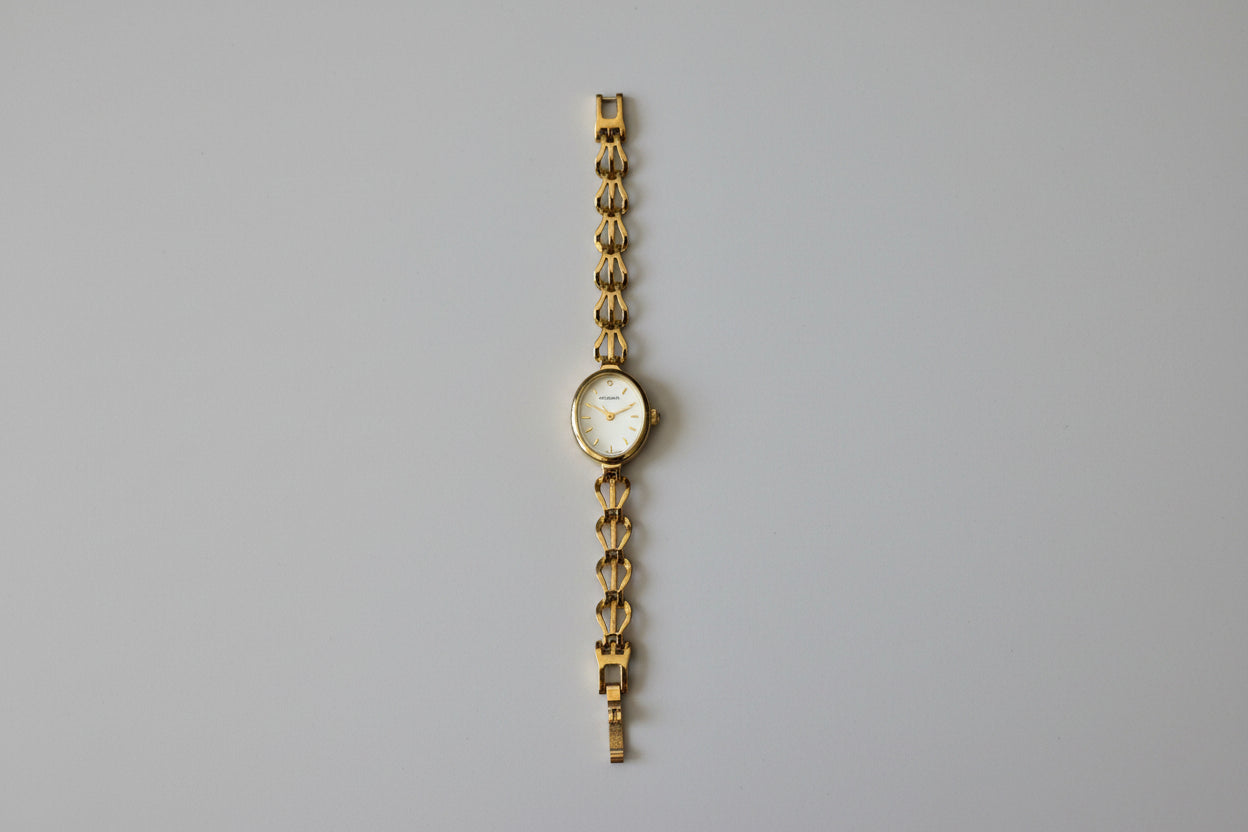 Vintage Ladies Sekonda gold tone watch with Oval Mother of Pearl face and intricate linked Bracelet