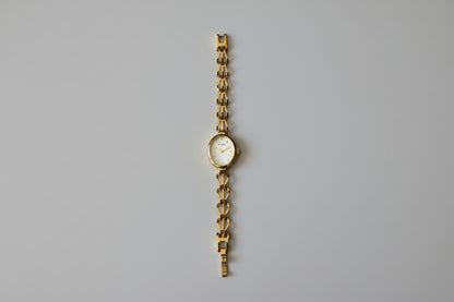 Vintage Ladies Sekonda gold tone watch with Oval Mother of Pearl face and intricate linked Bracelet