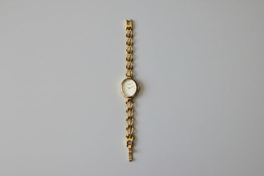 Vintage Ladies Sekonda gold tone watch with Oval Mother of Pearl face and intricate linked Bracelet