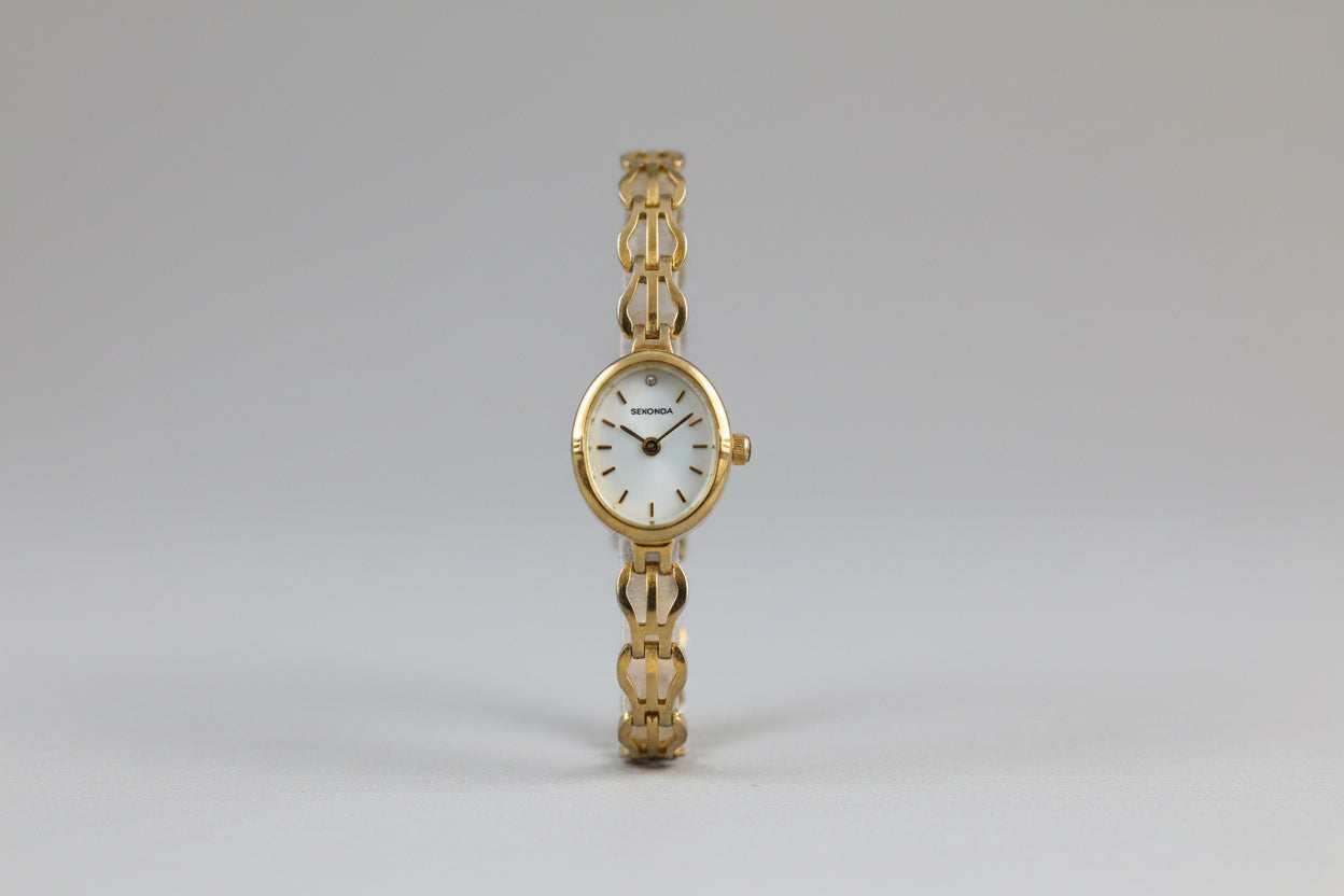 Vintage Ladies Sekonda gold tone watch with Oval Mother of Pearl face and intricate linked Bracelet