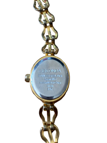 Vintage Ladies Sekonda gold tone watch with Oval Mother of Pearl face and intricate linked Bracelet